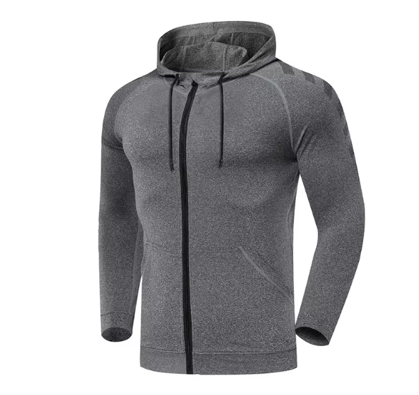 Изображение стильного набора спортивных костюмов с курткой на молнии и подходящих брюк, разработанных для спортивных выступлений и тренировок в спортзале.